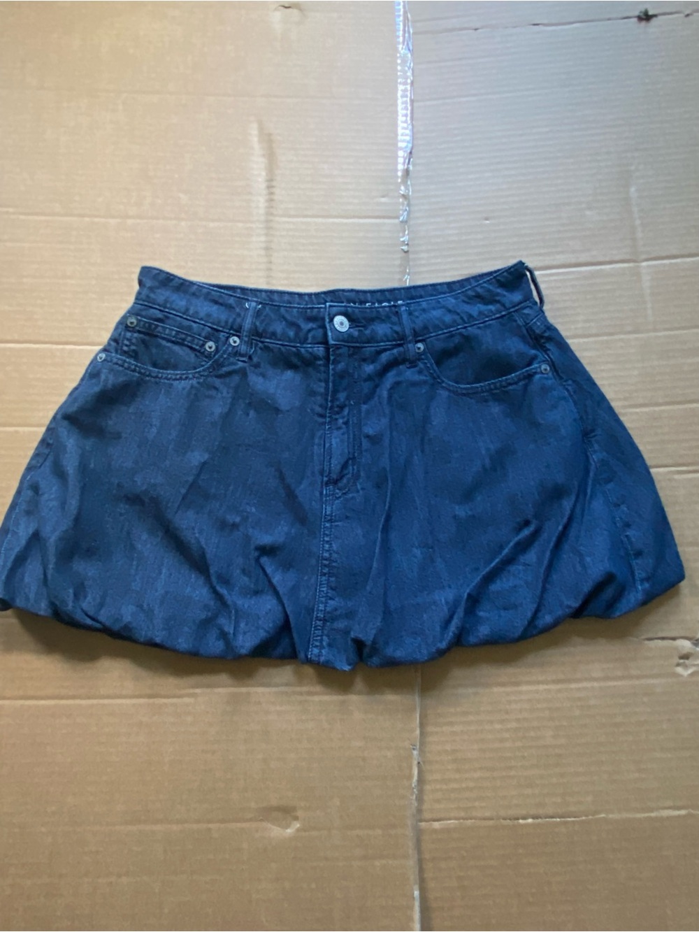 American Eagle Outfitters dark blue denim skirt with leather logo patch